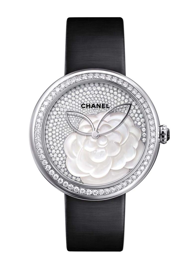 Chanel Mademoiselle Privé Camellia watch features a hand-crafted camellia flower on the dial. The layered mother-of-pearl discs create a billowing flower, which is then surrounded by 330 brilliant-cut diamonds, giving this perfect Mother's Day gift that e